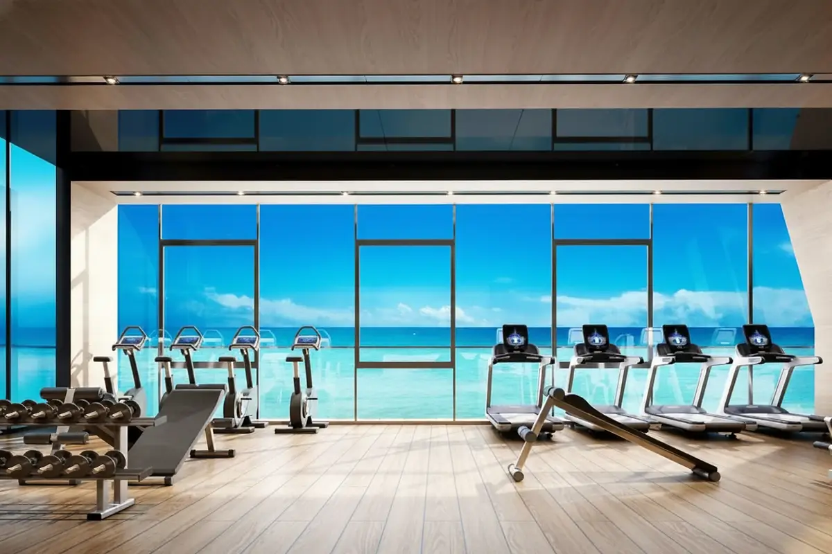 Beverly Mountain Bay Pattaya fitness center with treadmills, exercise bikes, weights, and panoramic ocean views.
