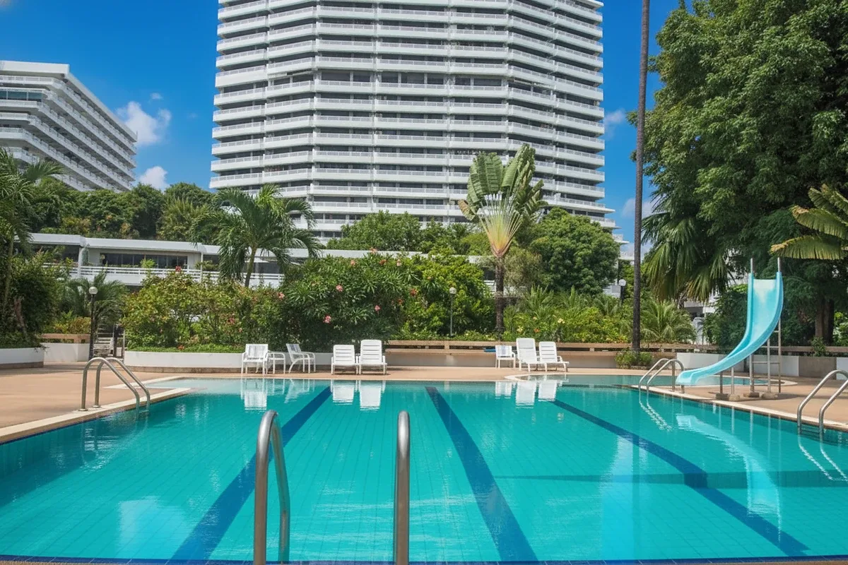Grand Condotel exterior with ocean view in the background and a canon decoration on the roof.