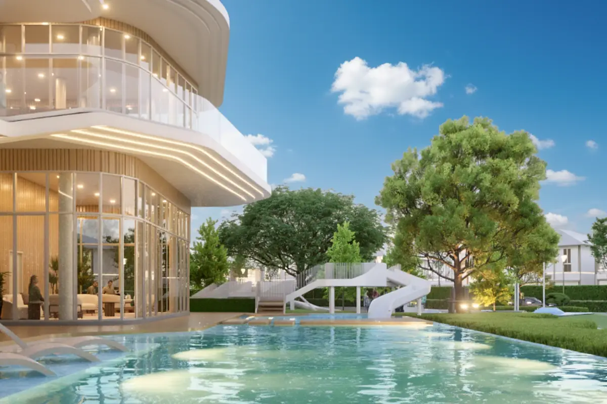 Horizon By Patta main entrance building with a modern design, cars, and lush green landscaping under a clear sky.