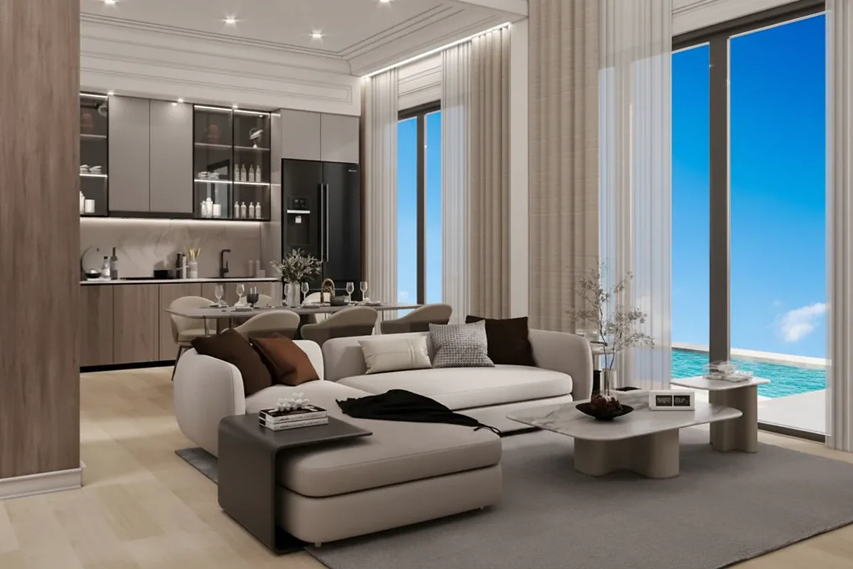 Madcha Le Villa home office and lounge area with built-in desk, shelving, and comfortable sofa.