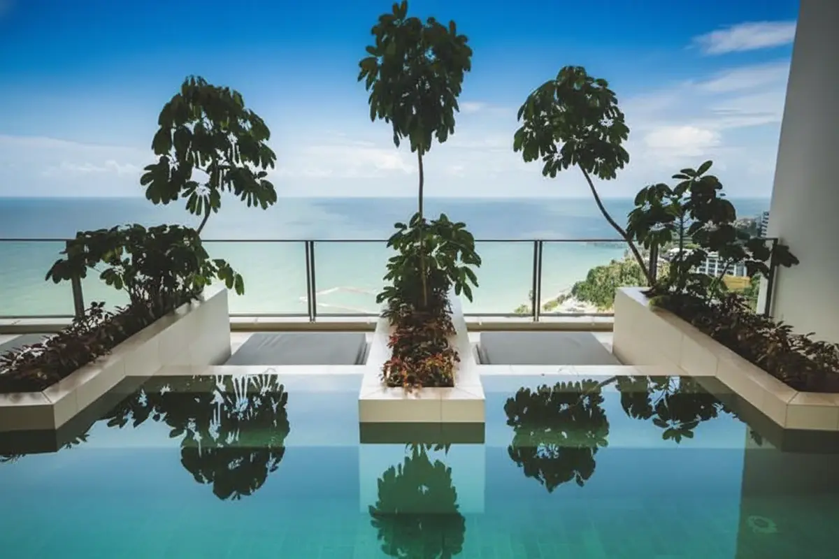 Northpoint rooftop pool with calm water reflecting the sky, overlooking the ocean and distant horizon.