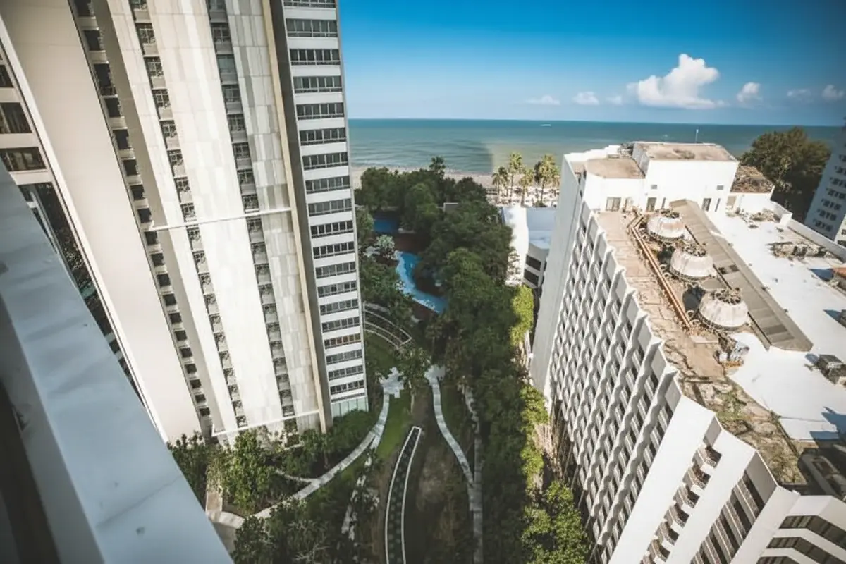 Northpoint aerial view of lush green gardens and pathways between two tall condo buildings.
