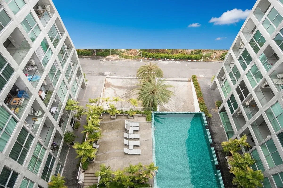 Park Royal 3 building exterior with a prominent sign and palm tree.
