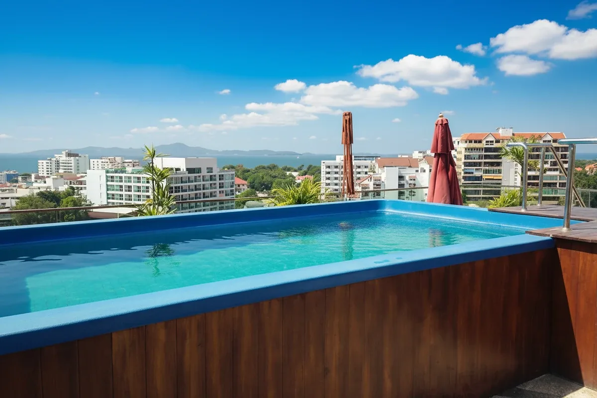 Park Royal 3 rooftop terrace with artificial grass, seating, and panoramic city views including Pattaya Tower.