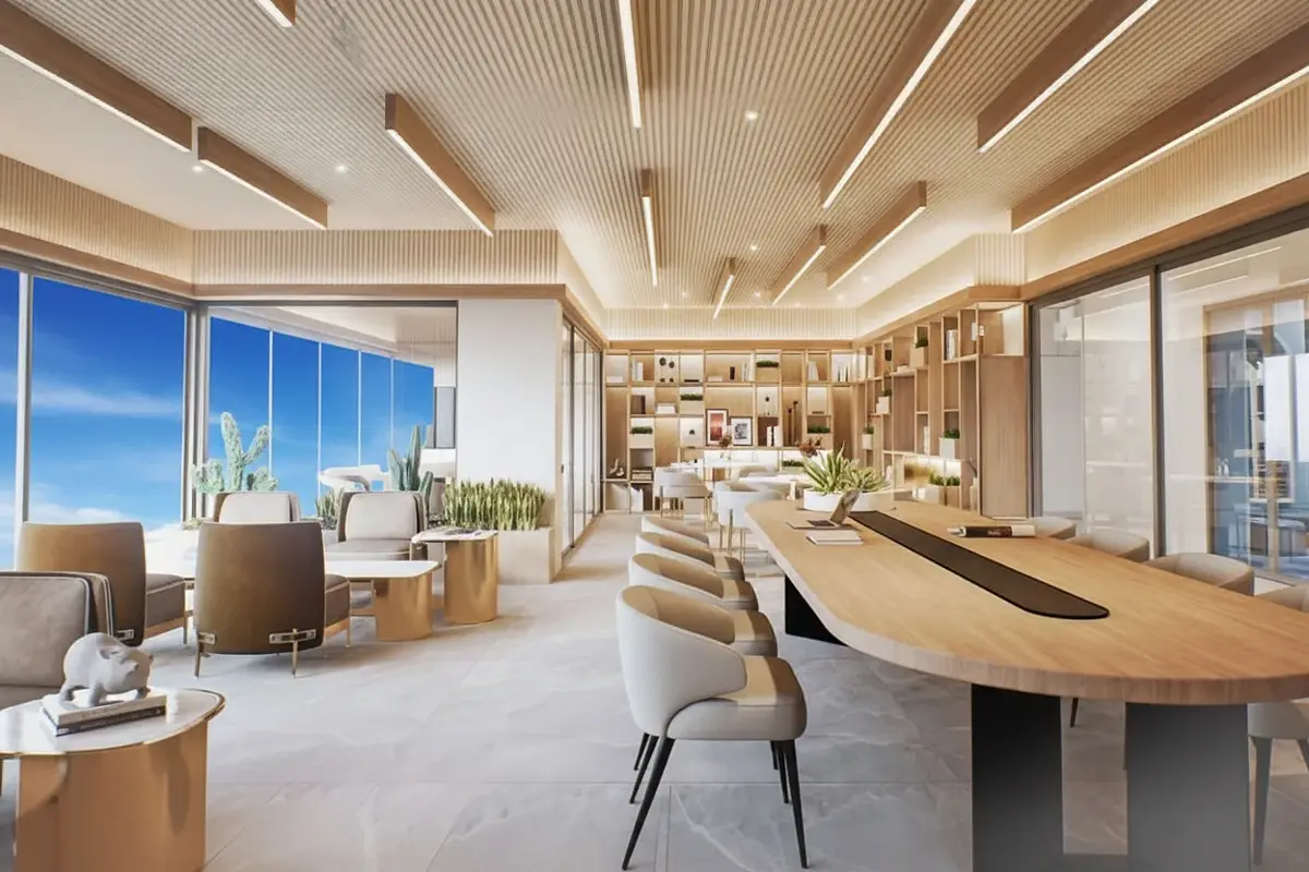 Pristine Park 3 co-working space with long wooden table, chairs, bookshelves, and large windows.