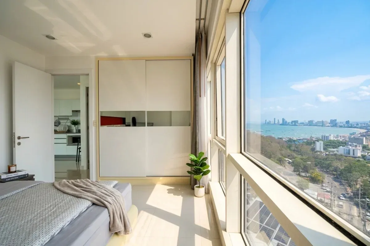 1 Bedroom Condo for Sale at The Vision bedroom with built-in wardrobe and panoramic sea and city views.