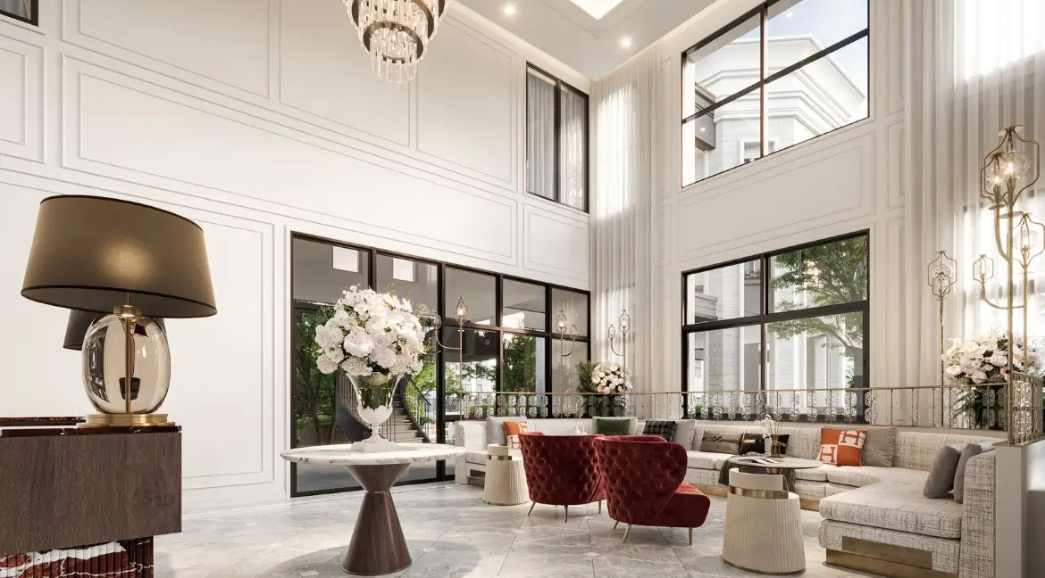 RAKHA PATTAYA grand living room with high ceilings, chandeliers, and modern seating areas.