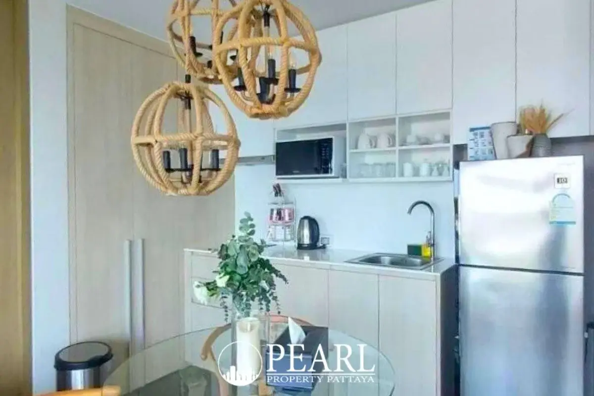 2 Bedroom Condo for Sale at Veranda Residence Pattaya modern kitchen with stainless steel fridge and rope pendant lights.