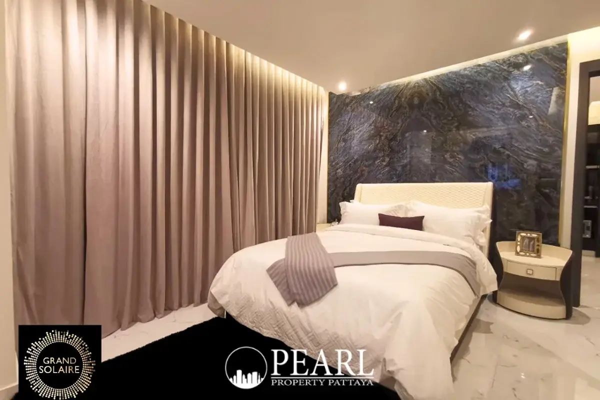 2 Bedroom Condo for Sale in Grand Solaire Pattaya master bedroom with king-size bed and city view