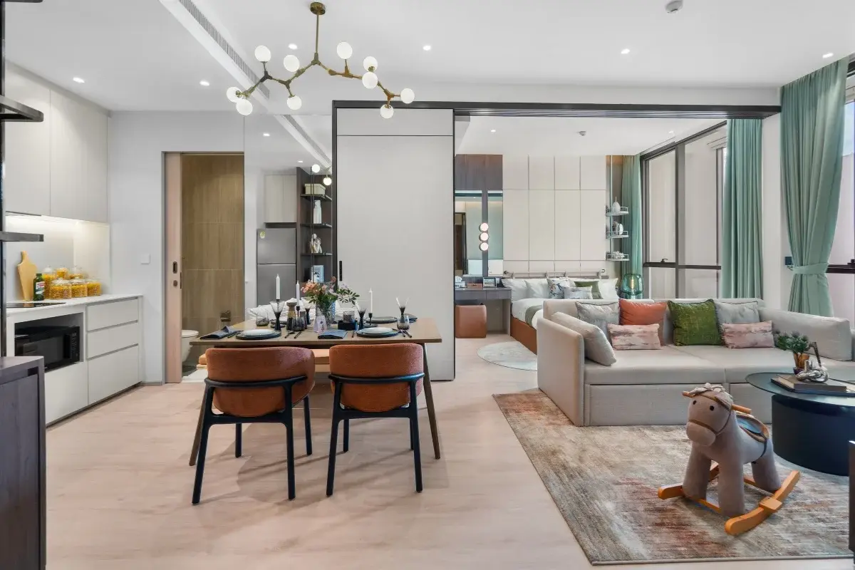 1 Bedroom Condo for Sale at Once Wong Amat: open-plan living room with dining area, kitchen, and glimpse of the bedroom.