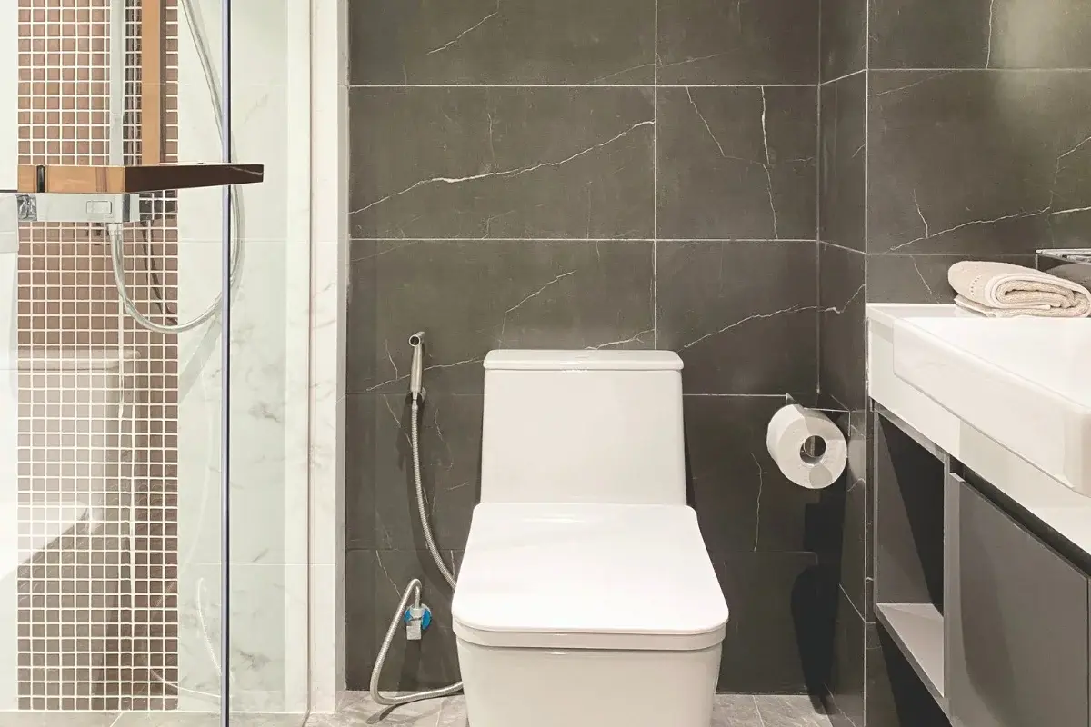 Studio Condo for Sale at Pristine Park 3 bathroom with toilet, bidet spray, and shower with mosaic tiles.