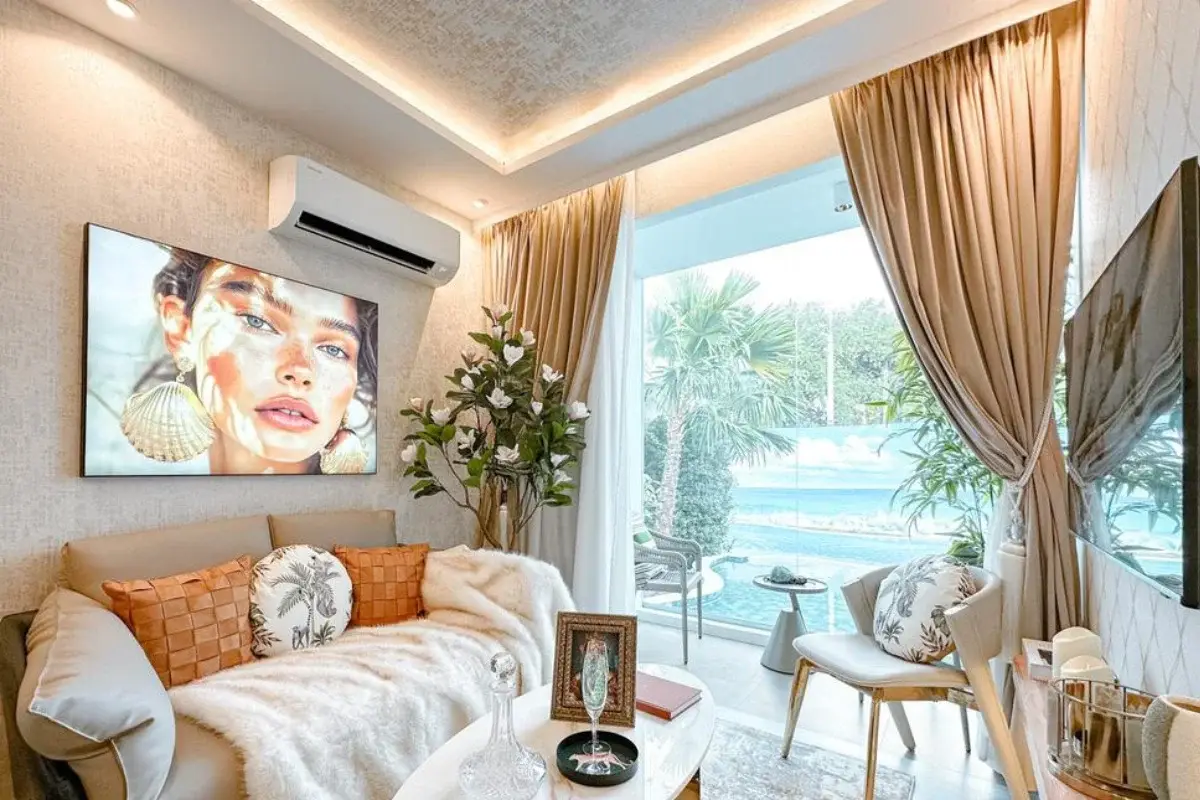 2 Bedroom Condo for Sale at The Riviera Santa Monica living area with sofa, decorative items, and view of the swimming pool.