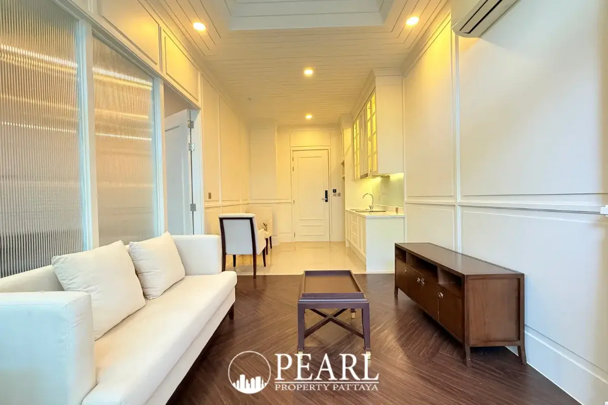 1 Bedroom Condo for Sale in The Grand Pattaya living room with sofa and TV