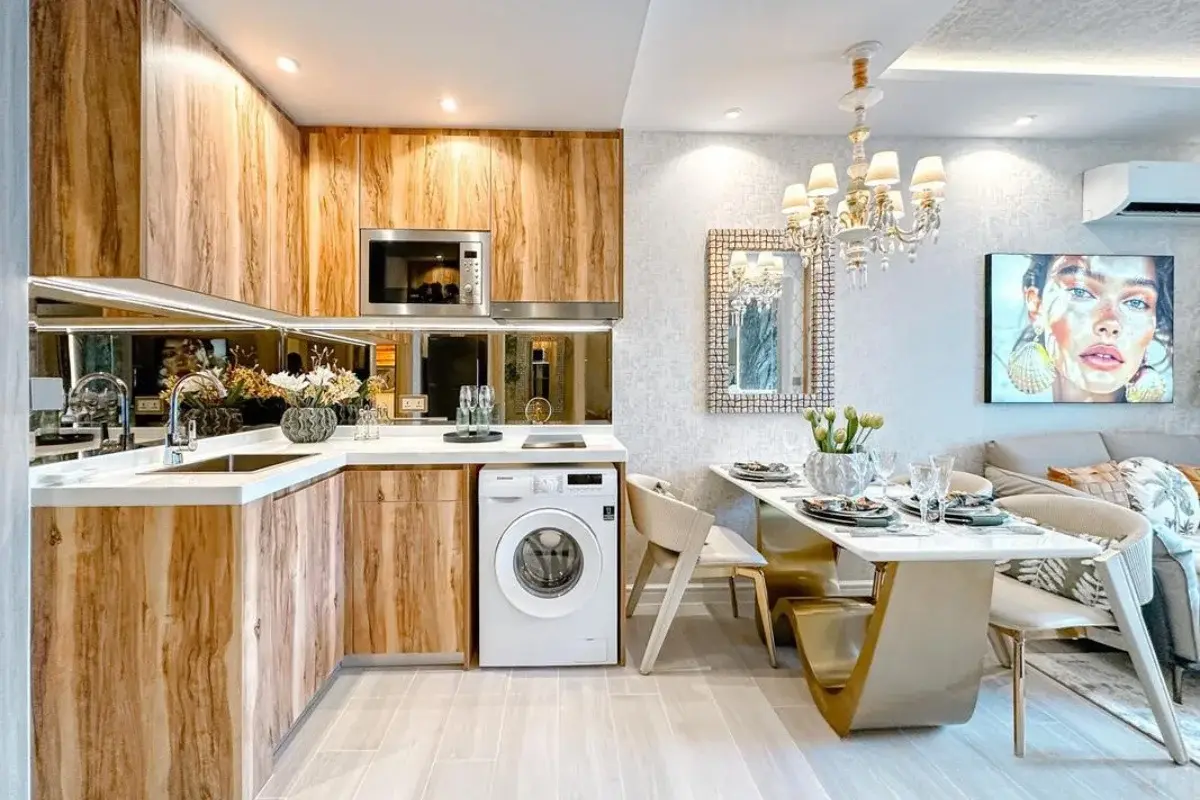 2 Bedroom Condo for Sale at The Riviera Santa Monica compact kitchen with wood cabinets, built-in appliances, and dining area.