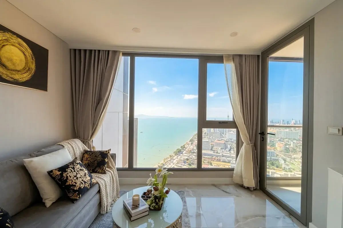 1 Bedroom Condo for Sale at Copacabana Beach Jomtien modern kitchen, dining area, and living room with stylish decor.