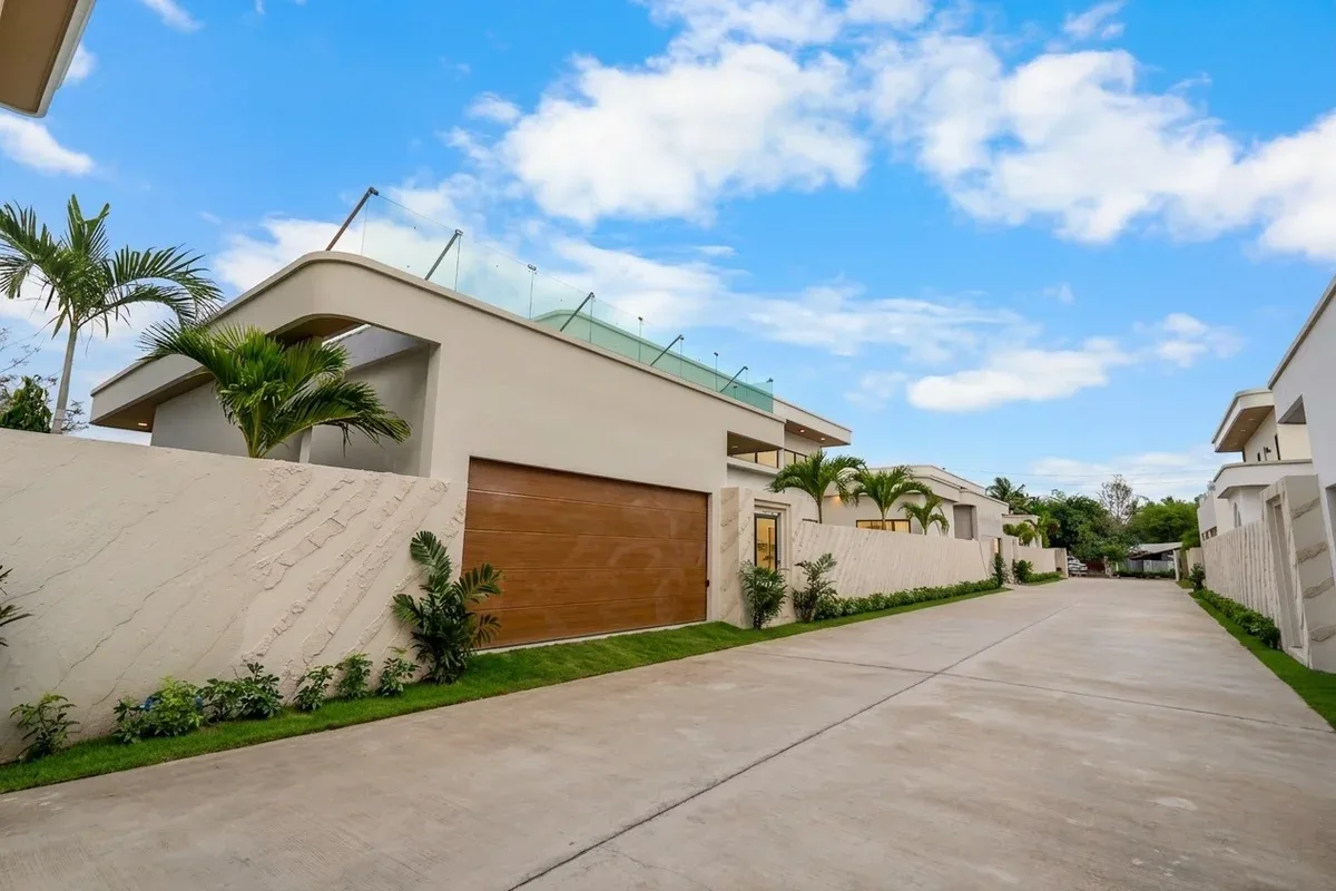 3 Bedroom House for Sale at Perla Villa, private outdoor swimming pool with lounge chairs and house exterior.