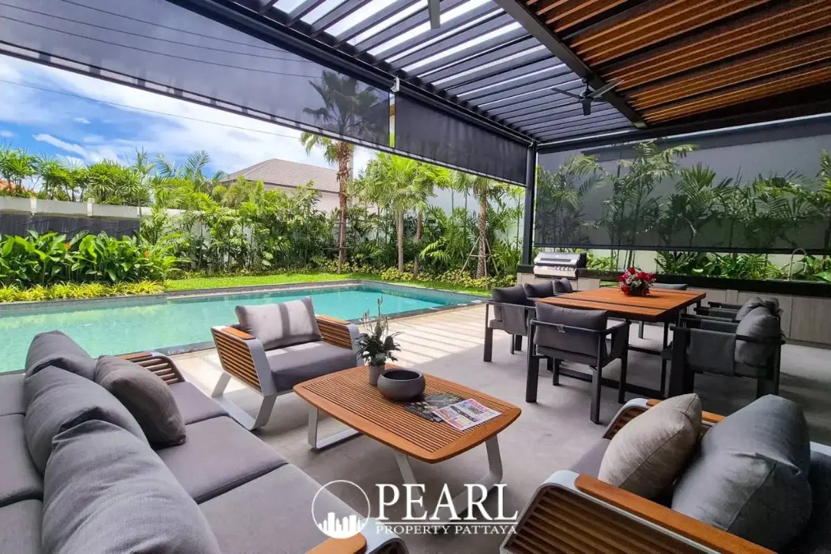 5 Bedroom House for Sale in Central Pattaya private swimming pool surrounded by lush greenery