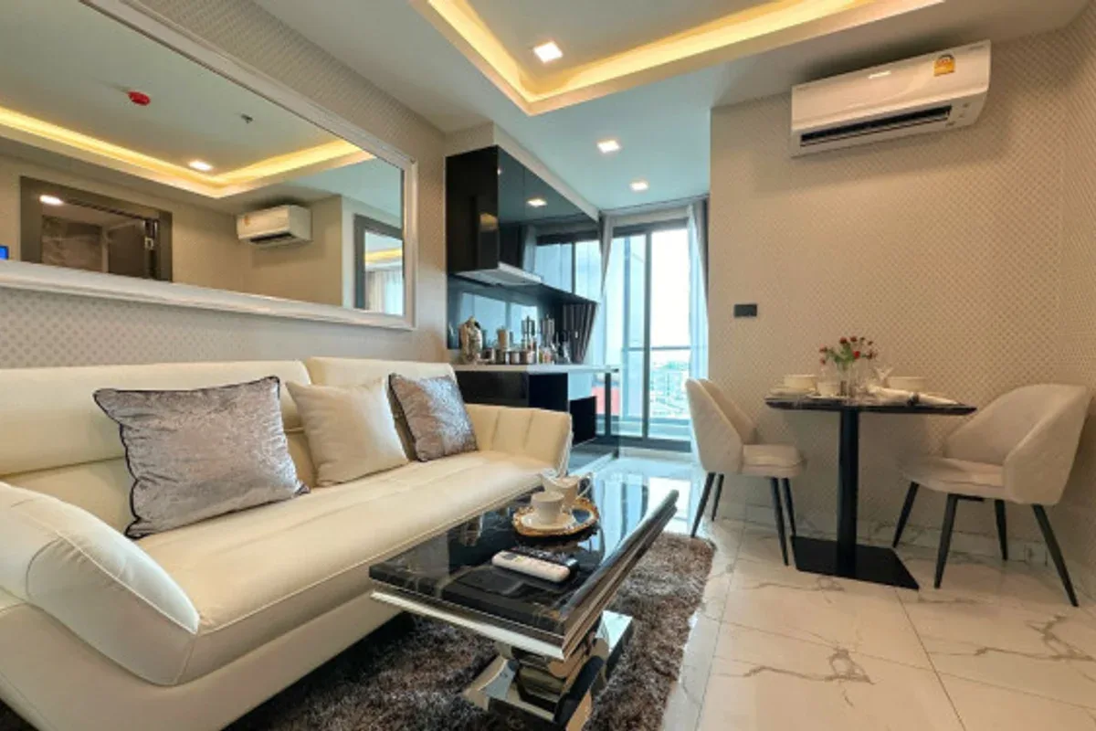 1 Bedroom Condo for Sale in Arcadia Millennium Tower living room with sofa and TV