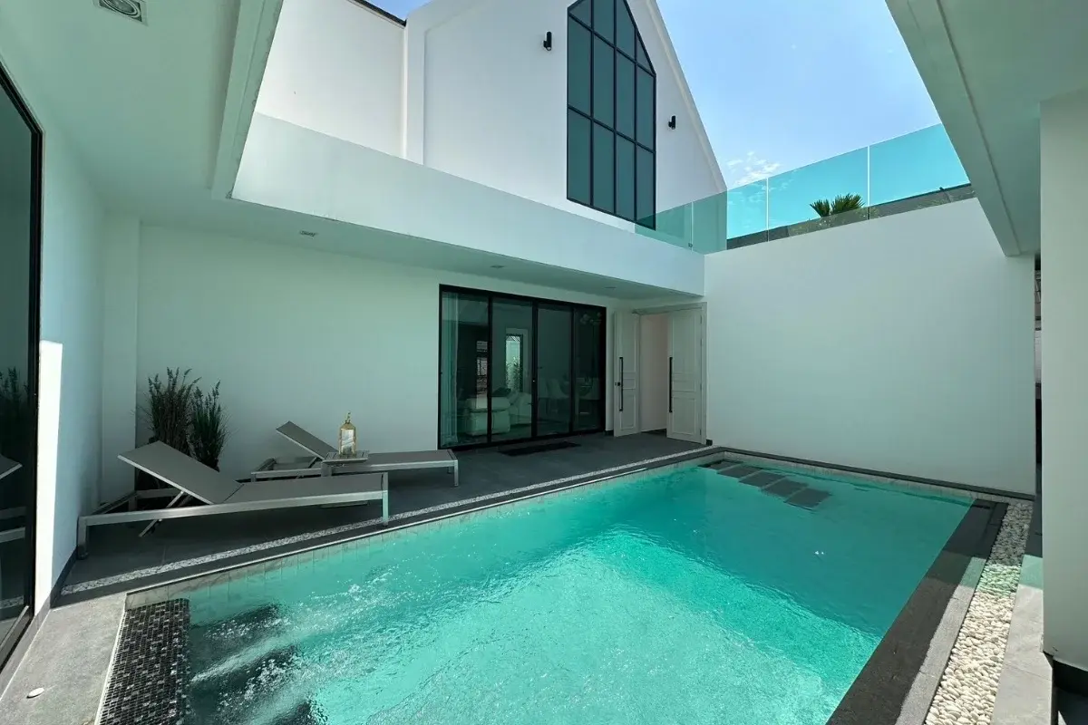 3 Bedroom House for Sale at Larelana Villa private courtyard with swimming pool and two lounge chairs.