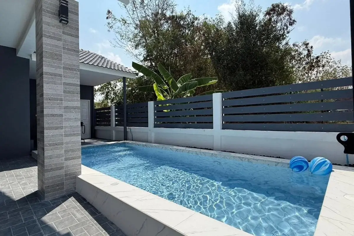 3 Bedroom House for Sale in Nong Prue narrow swimming pool with tiled surround and privacy fence.