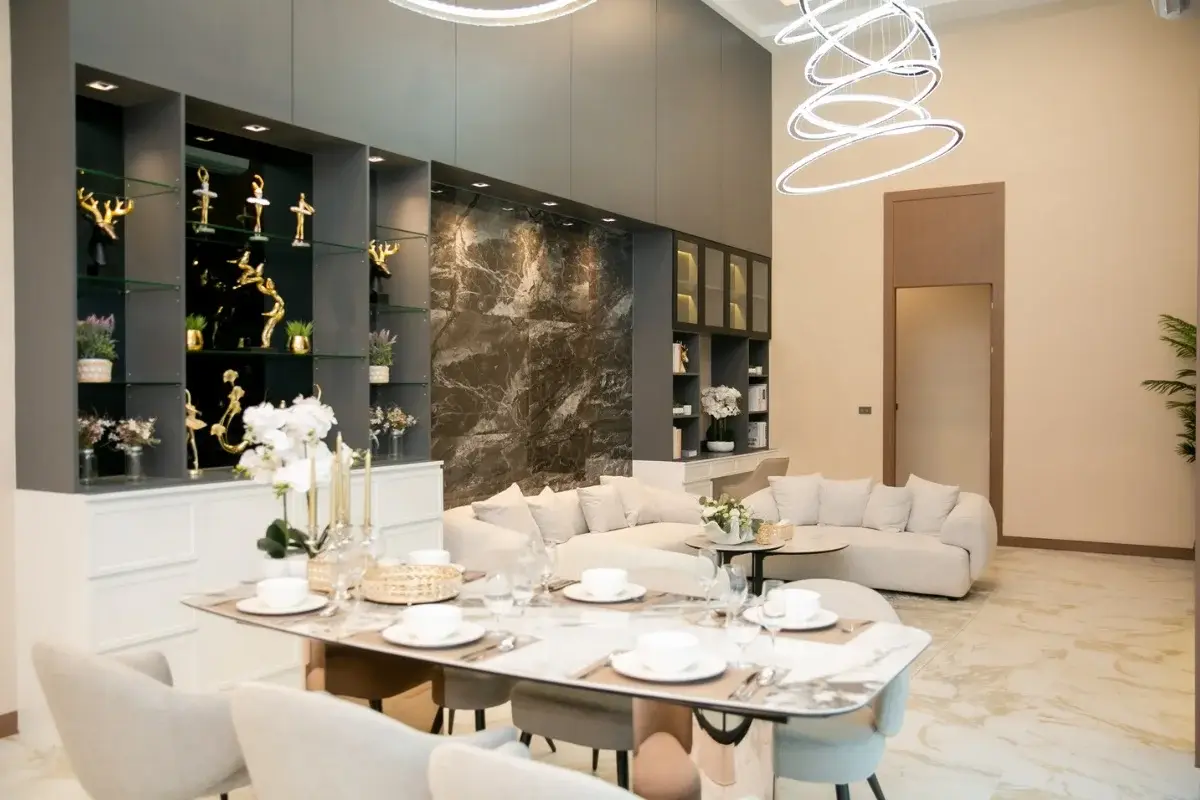 3 Bedroom House for Sale at Larelana Villa open-plan living and dining area with modern decor and high ceilings.