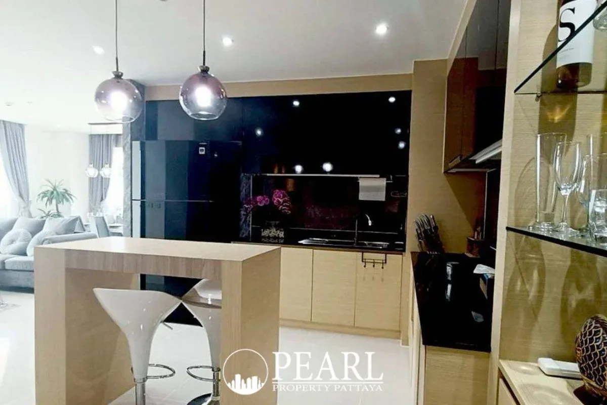 2 Bedroom Condo for Sale in Grande Caribbean master bedroom with king-size bed and balcony access