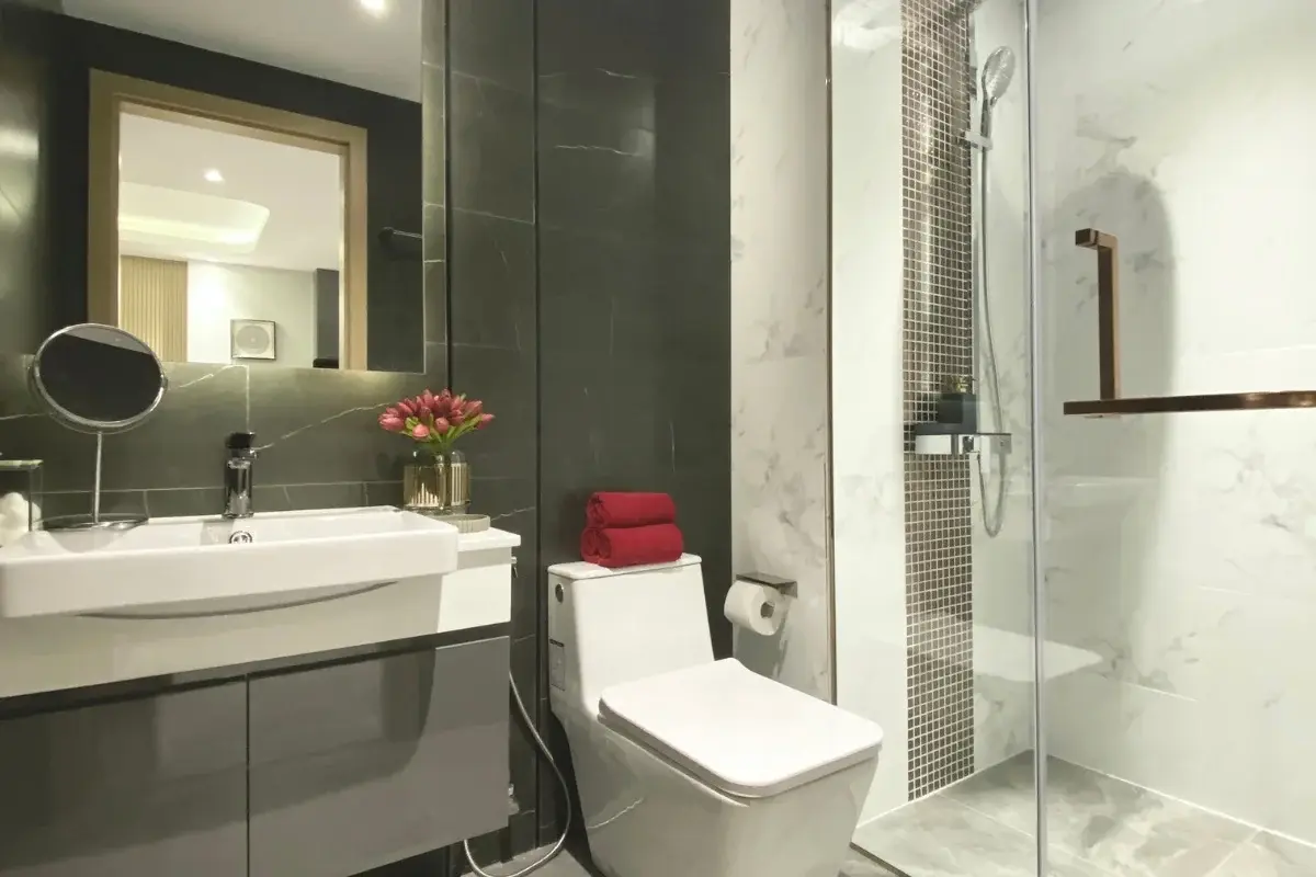 1 Bedroom Condo for Sale at Pristine Park 3, contemporary bathroom with vanity, toilet, and glass-enclosed shower.