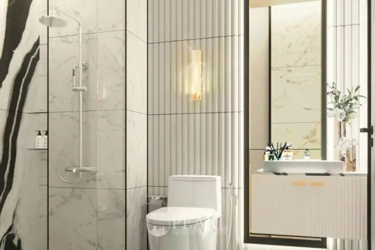 1 Bedroom Condo for Sale in The Embassy Jomtien bathroom with shower and vanity