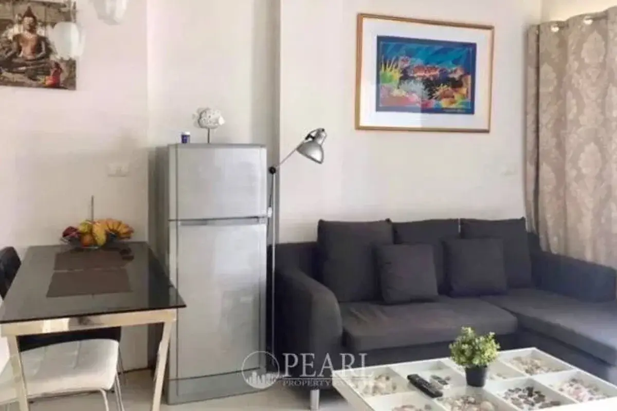 1 Bedroom Condo for Sale in The Gallery Condominium living room with sofa and TV