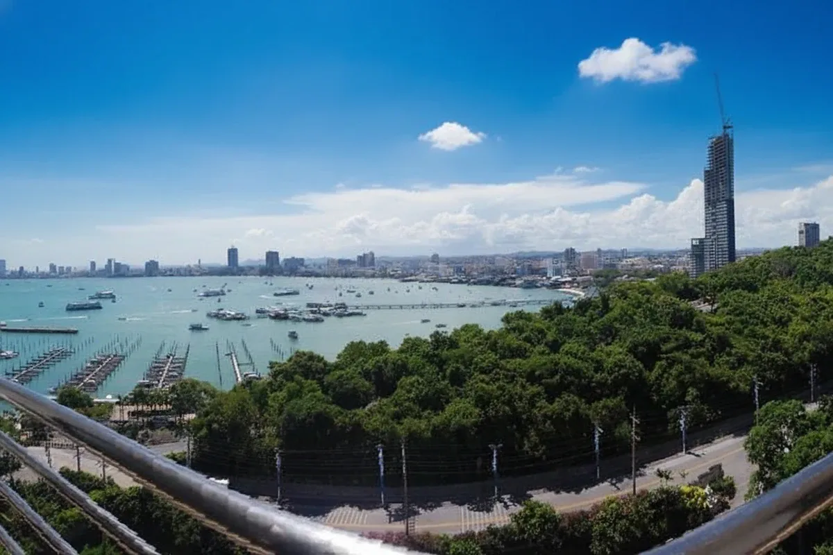 Royal Cliff Garden large outdoor pool with blue water and surrounding greenery, overlooking the ocean.