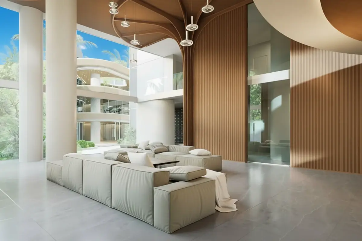 Secret Garden Condominium exterior with a swimming pool and sun loungers surrounded by lush tropical plants.