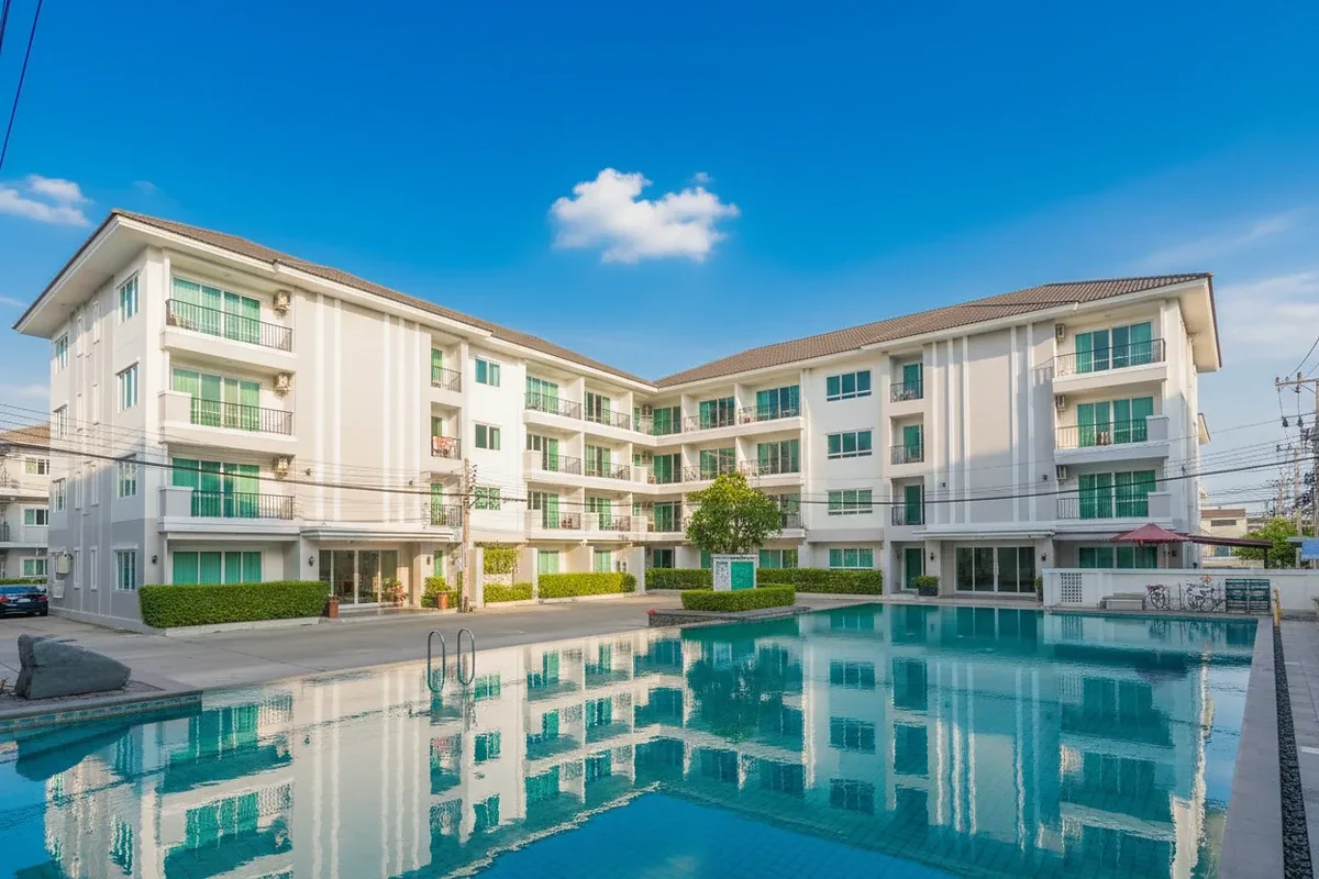 The Empire Tower Pattaya, a studio condo with a bed, small dining area, and compact kitchen visible in the background.