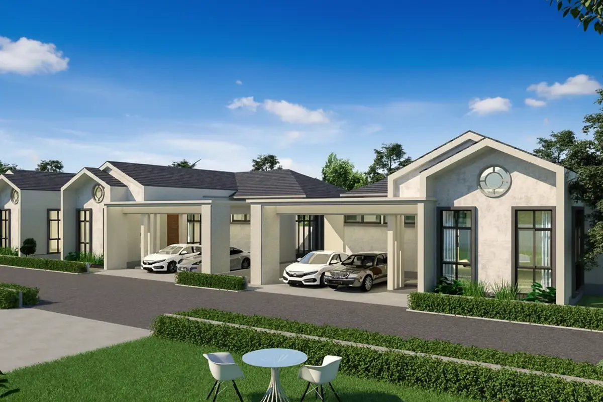 The Hamlet Pattaya, exterior view of modern houses with carports, green lawns, and a street under a blue sky.