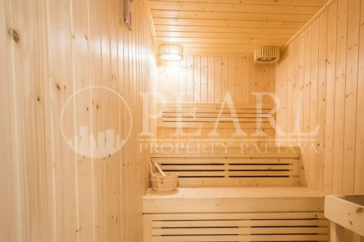 The Orient Resort & Spa modern fitness center with various exercise machines and large windows.