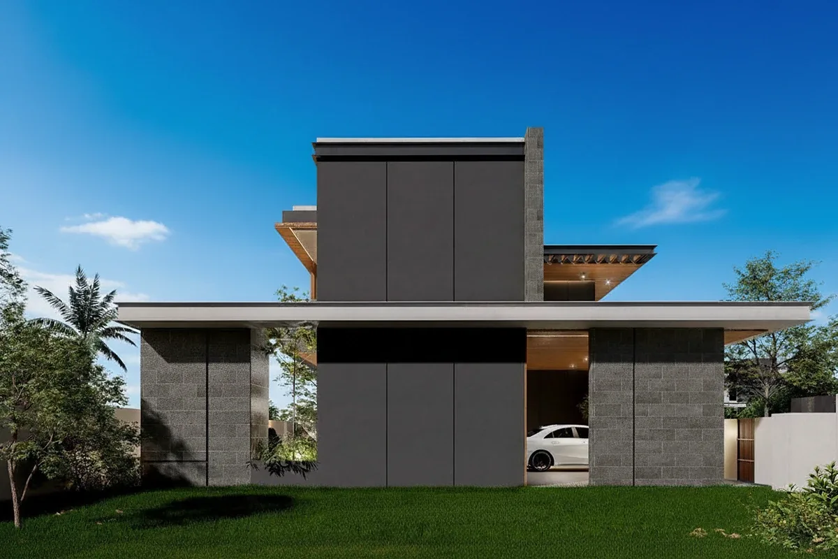 The Ozone Wealth Jomtien Pool Villa Pattaya: Modern house exterior with dark grey facade, car in garage, and green lawn.