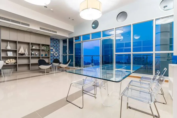 Supalai Mare Pattaya ship-themed playground structure on a landscaped rooftop with a modern condo tower.