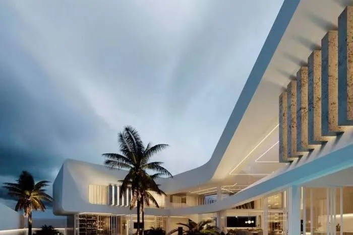 Glory Village Pattaya modern house exterior at dusk with palm trees and dramatic sky.