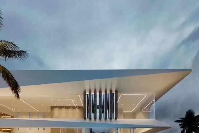 Glory Village Pattaya contemporary house exterior with sharp lines, glass, and illuminated details at night.