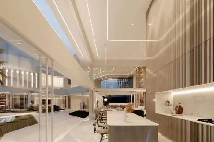 Glory Village Pattaya modern house upper floor with sleek design, illuminated ceilings, and glass railings.