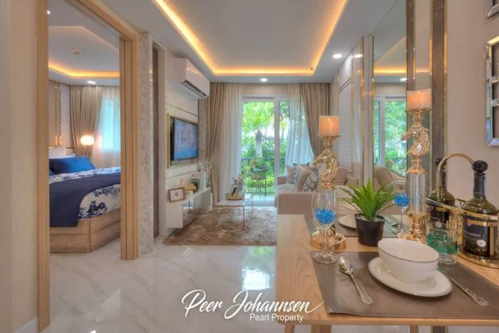 Dusit Grand Park 2 aerial view of multiple residential buildings surrounding a large pool area with landscaping.