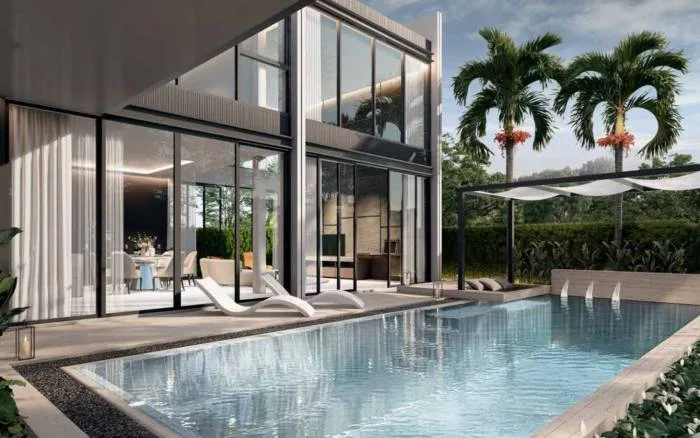 Highland Park Pool Villas Pattaya contemporary house exterior with a private pool, two cars in the driveway, and large glass facades.