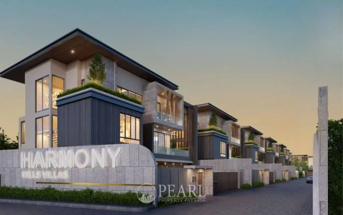 Harmony Hills Villas Pattaya: Entrance sign for the development with a row of modern villas and sleek architecture.