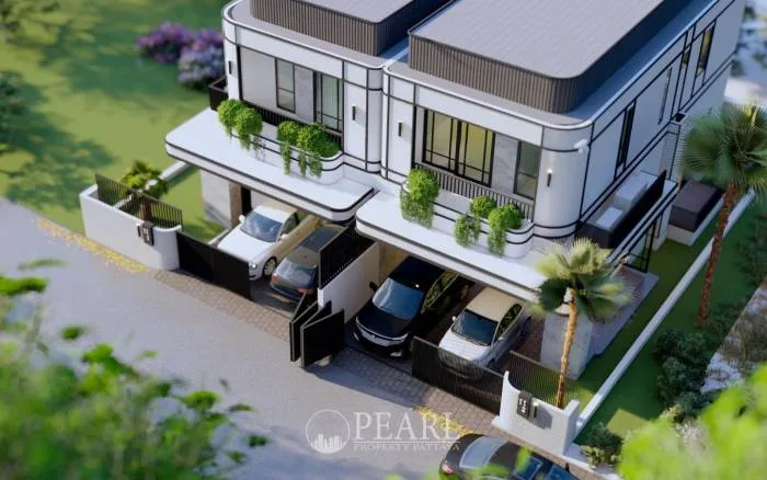 Glam Boonsampan 6 aerial view showing two modern townhouses with carports, balconies, and surrounding landscape.
