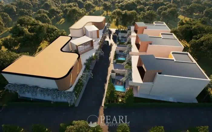 Baan Mae Residence 69 aerial view of the complex with multiple buildings, lush green landscaping, and pools.