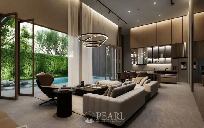 Baan Mae Residence 69 spacious living room with high ceilings, large windows, and contemporary furniture.