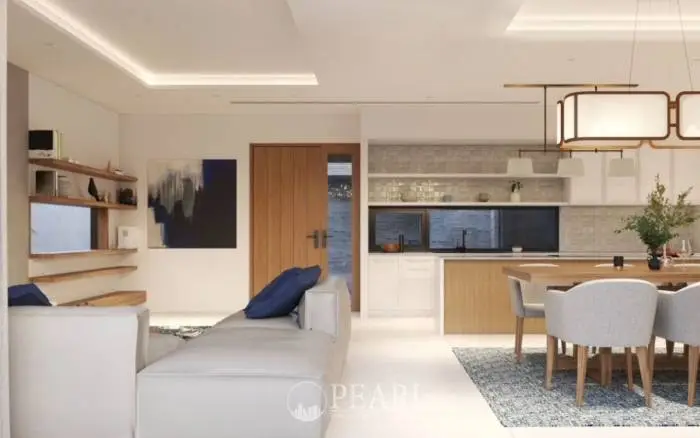 Prime Habitat front exterior of a modern house with an integrated garage, light stone facade, and palm trees.