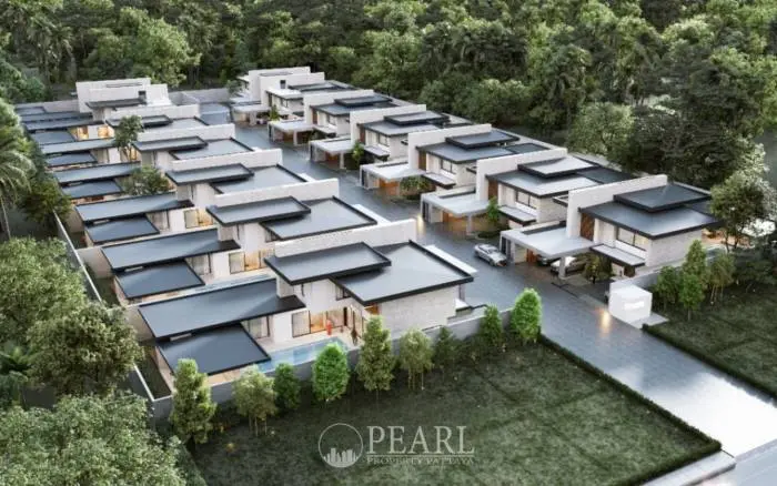 Prime Habitat aerial view of a modern residential complex with multiple houses and lush green landscaping.