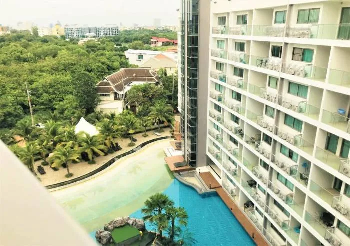 Laguna Beach Resort 1 aerial view of the resort's large pool area, artificial beach, and surrounding buildings.