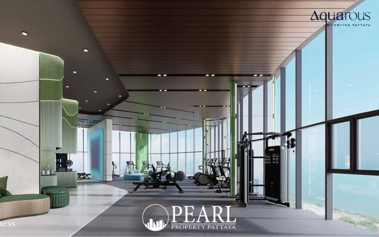 2 Bedroom Executive Suite Condo for Sale at Aquarous Jomtien Pattaya modern fitness center with exercise equipment and ocean views.
