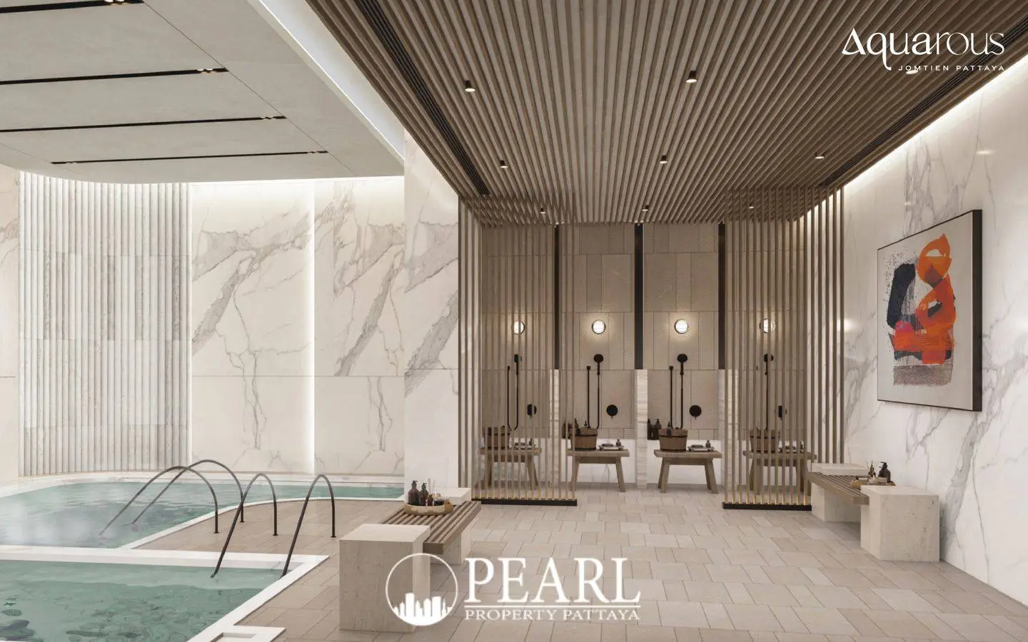 2 Bedroom Executive Suite Condo for Sale at Aquarous Jomtien Pattaya indoor pool area with lounging benches and marble walls.